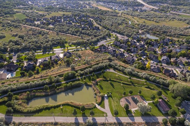 Aerial view of property and surrounding area with a nearby body of water and nearby suburban area | Image 27
