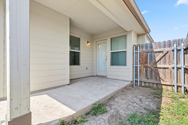 Back covered patio area and a gate | Image 28
