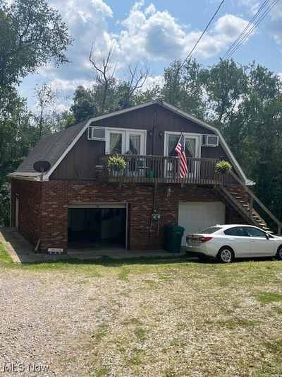 View of front facade featuring a garage and a front lawn | Image 3