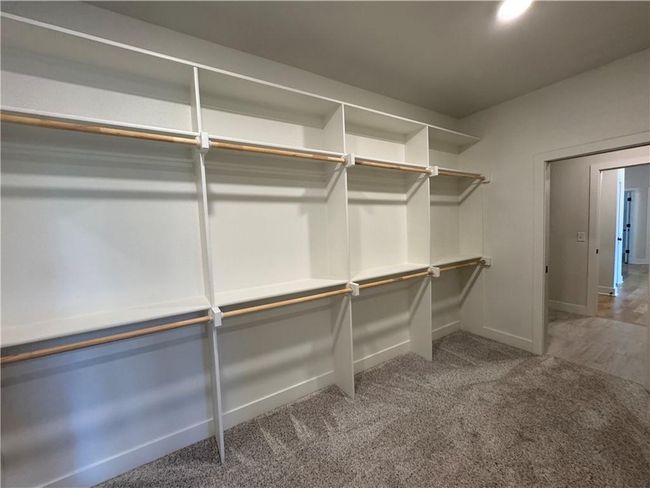 Spacious closet with carpet | Image 40