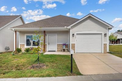 Single story home featuring a garage and a front lawn | Image 1