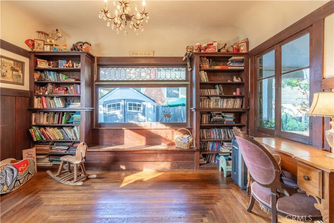 Formal dining with classic built-ins, wainscoting, and preserved wood detailing throughout. | Image 6