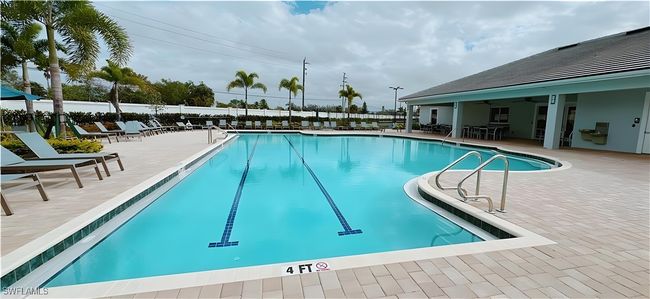 Community pool with a patio area and a ceiling fan | Image 22