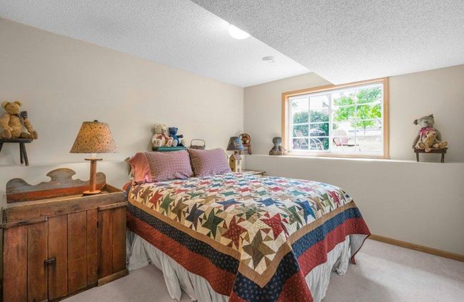 Lower-Level Bedroom with a large wall-length closet. | Image 19