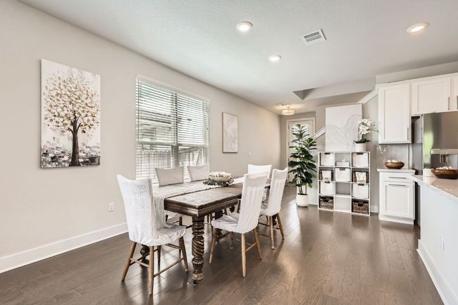 Dining room with dark wood-type flooring and recessed lighting | Image 12