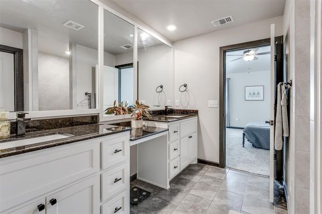 Bathroom featuring visible vents, a sink, double vanity, and connected bathroom | Image 19