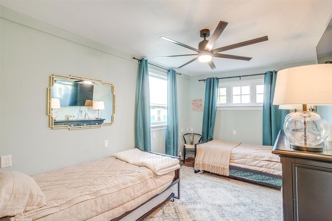 Bedroom featuring ceiling fan | Image 31