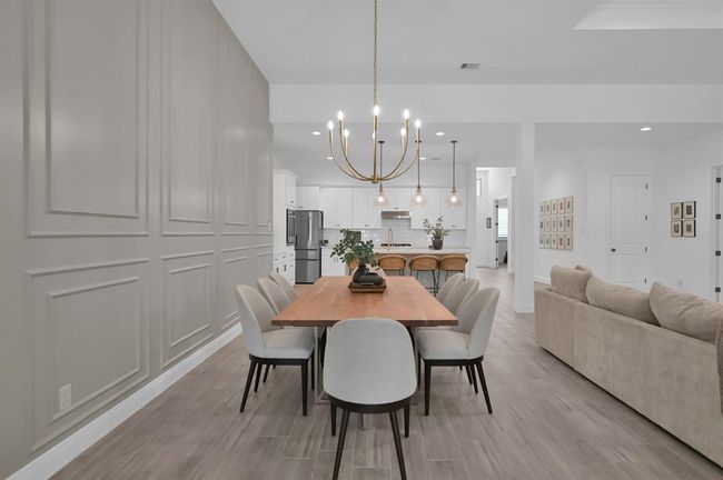 Custom paneling in the dining area. | Image 14