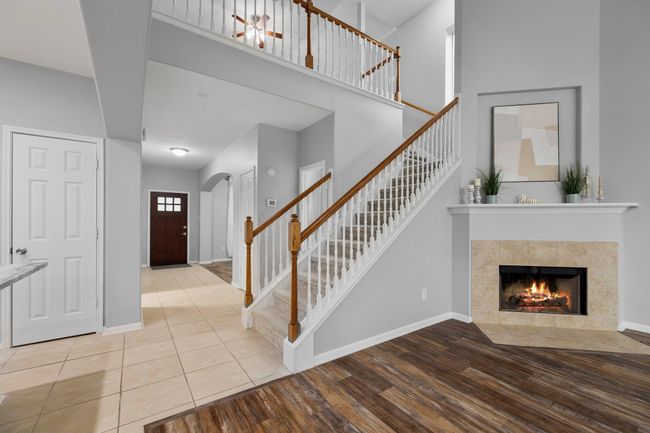 From this angle, you get a sense of the home's open layout—where the foyer, living room, and staircase connect with effortless flow. | Image 24