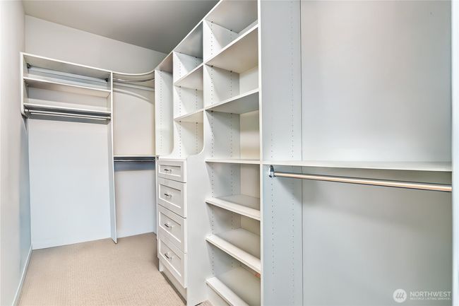 Enjoy a large walk-in closet and a serene atmosphere of the primary bedroom making it the perfect personal retreat with comfort and functionality in mind | Image 22