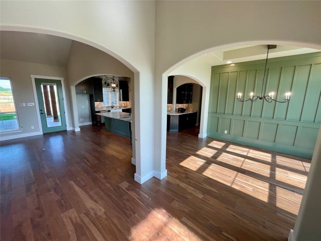 View of dining room and kitchen from entry. | Image 6