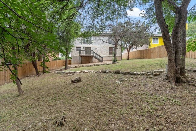 View of yard with a fenced backyard | Image 37