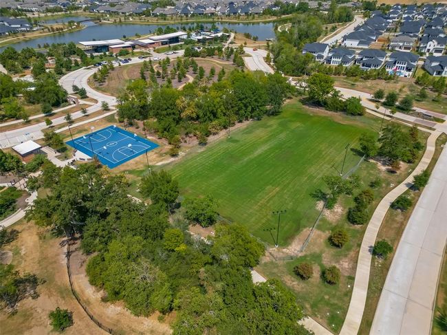 Features a single-family home with a spacious yard in Bridgeland, a master-planned community offering lakes, pools, sidewalks, and green spaces. | Image 31