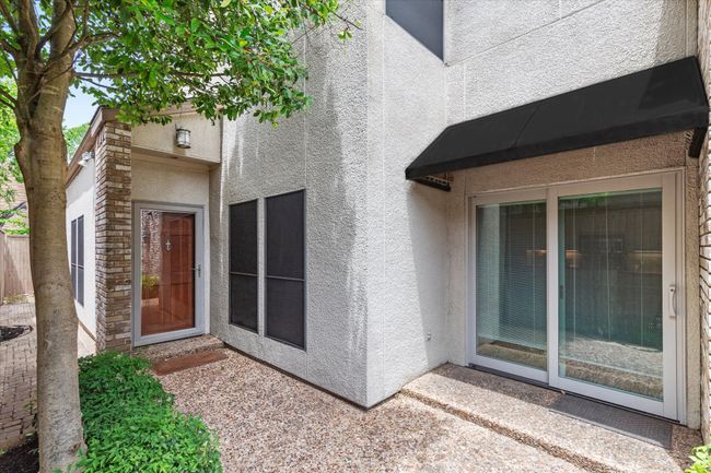 View of exterior entry featuring stucco siding | Image 4