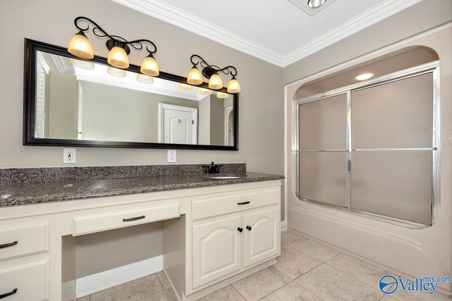 Tile flooring, crown molding, trey ceiling, recessed lighting, ceiling fan | Image 36
