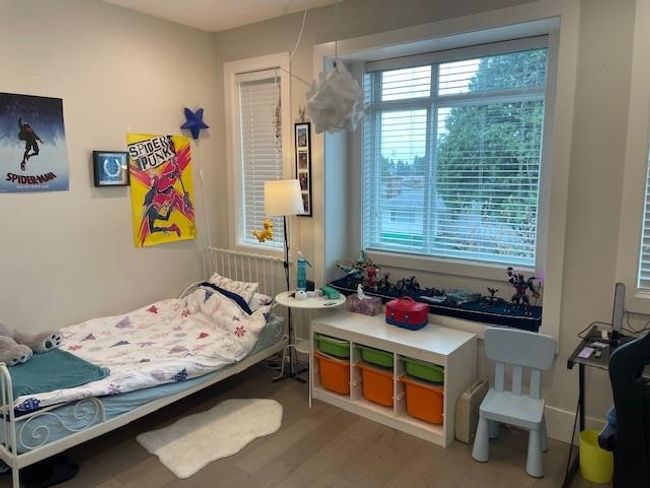 Bedroom with wood finished floors | Image 15