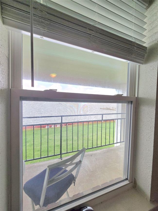 Bright window offering serene views, perfect for relaxation. | Image 12