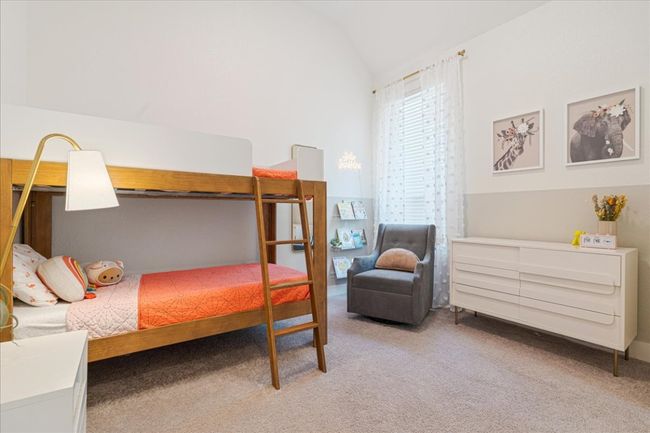 Bedroom featuring lofted ceiling and carpet flooring | Image 25