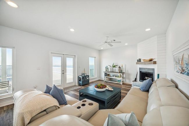cozy family room with wood burning fireplae | Image 12