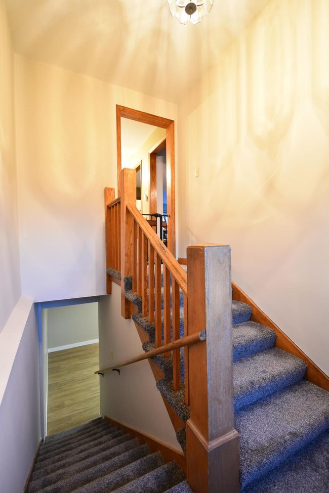 stairwell new carpet & fresh paint offers quick access to a grill/smoker | Image 39