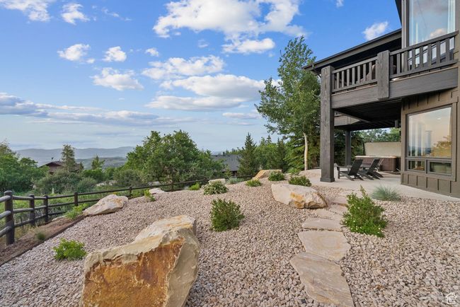 View of yard with a patio area, a mountain view, and a balcony | Image 82