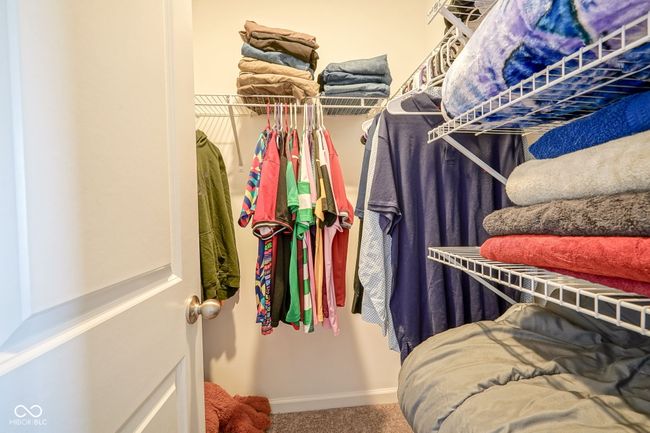 spacious closet with carpet floors | Image 23