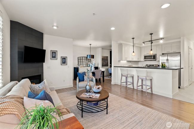 Open living with gas fireplace. | Image 4