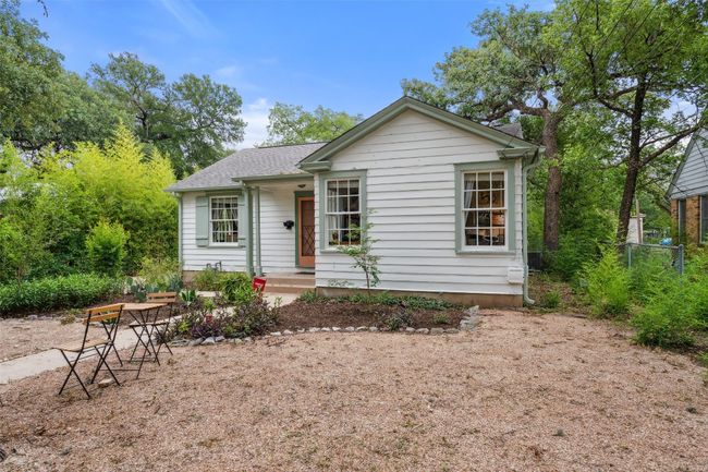 Beautiful front of house with landscaped front yard and tall trees | Image 20