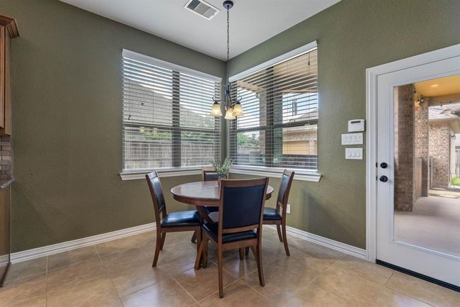 Enjoy breakfast in the nook just off the kitchen. | Image 13