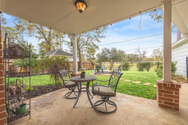 Relax on your covered patio with tranquil views of Meyer Park. | Image 26