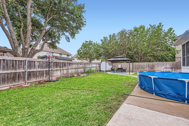 Fenced backyard featuring a gazebo and a patio | Image 26