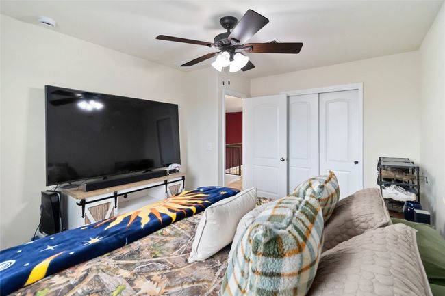 Bedroom with a closet and a ceiling fan | Image 10
