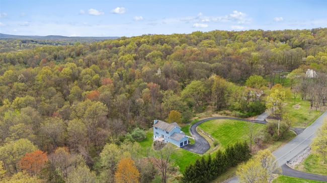 Birds eye view of property featuring a forest view | Image 40
