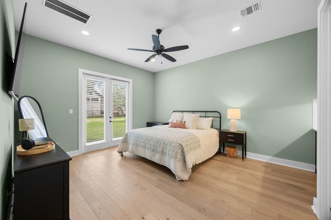 Bedroom with access to exterior, light wood finished floors, recessed lighting, and a ceiling fan | Image 24