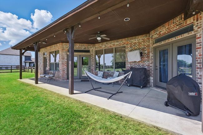 View of patio / terrace with ceiling fan, grilling area, and french doors | Image 29