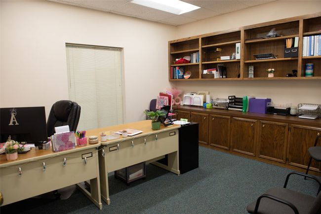 Office space featuring dark colored carpet and a paneled ceiling | Image 13