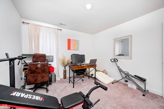 workout area with baseboards, visible vents, and carpet | Image 22