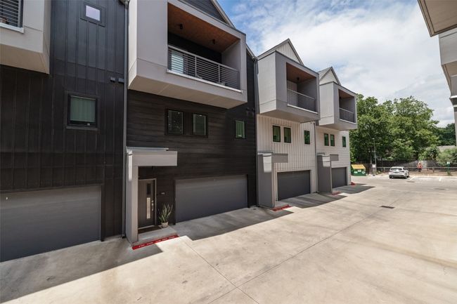 View of property with an attached garage | Image 4
