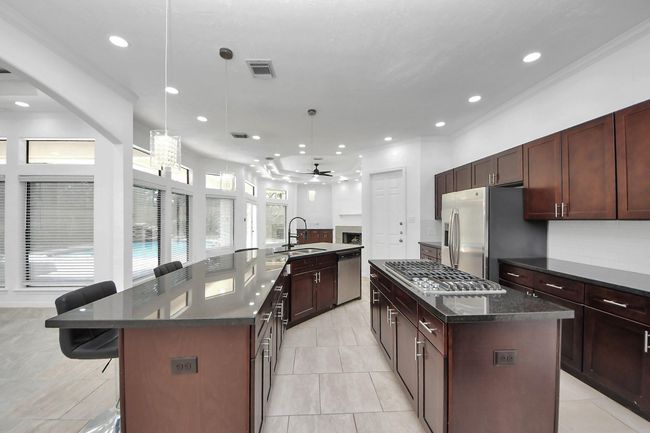 Kitchen with plenty counter space and cabinet storage | Image 12
