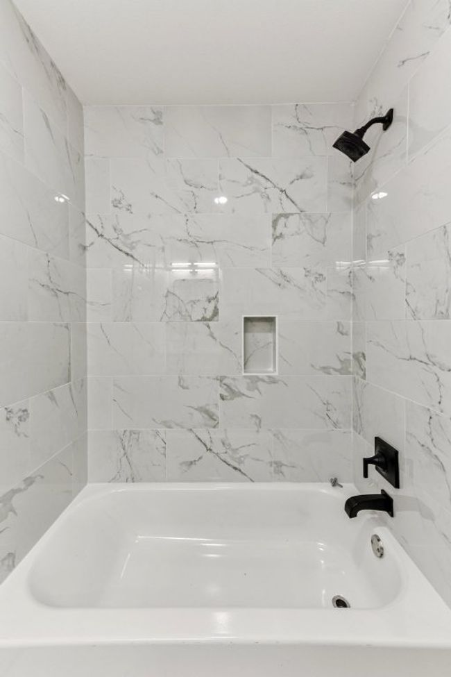 Full bath featuring bathing tub / shower combination | Image 26