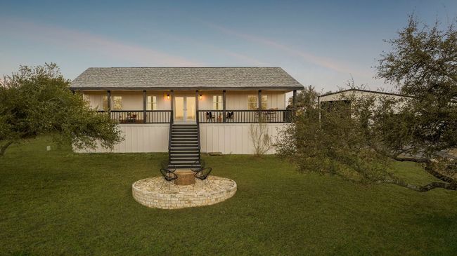Front Elevation of home has new exterior white hardi plank with black accents | Image 35