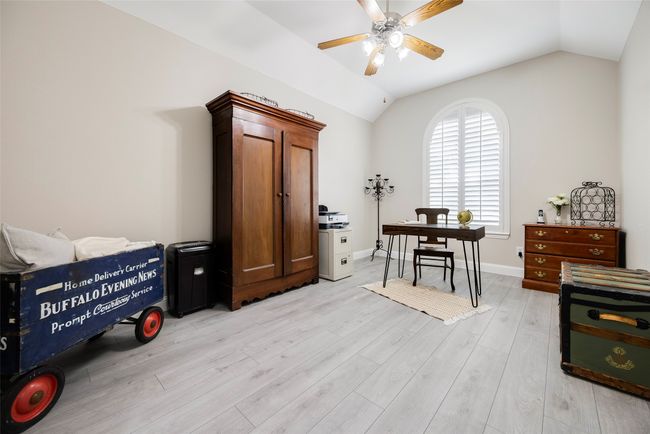 Office space with lofted ceiling, a ceiling fan, LVP, and baseboards | Image 19