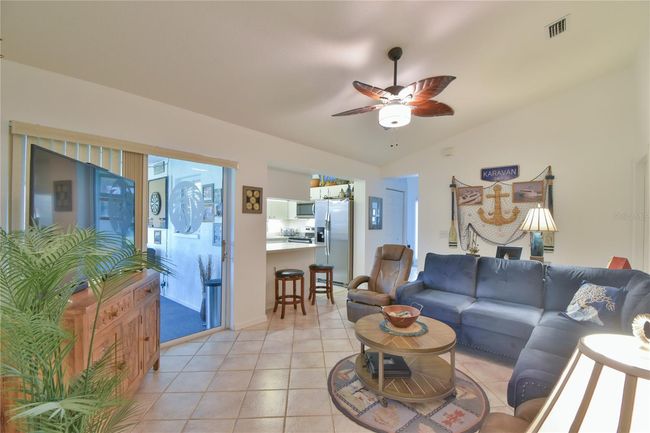 Family Room off the Kitchen with Ceiling Fan and Light | Image 9