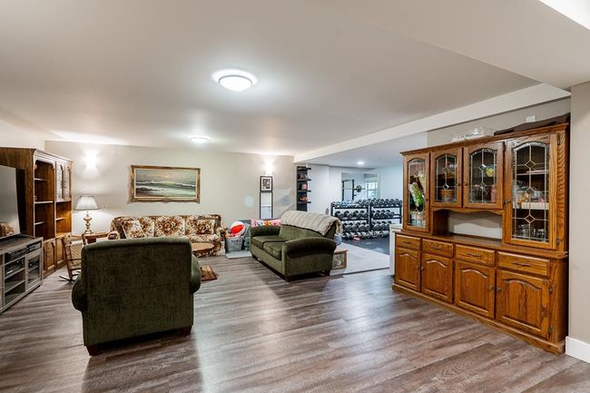 Living room with dark wood-style flooring | Image 26