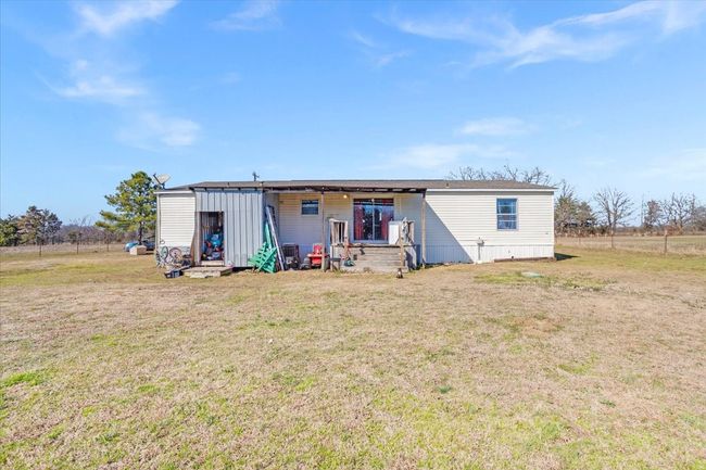 Back of house with a lawn | Image 24