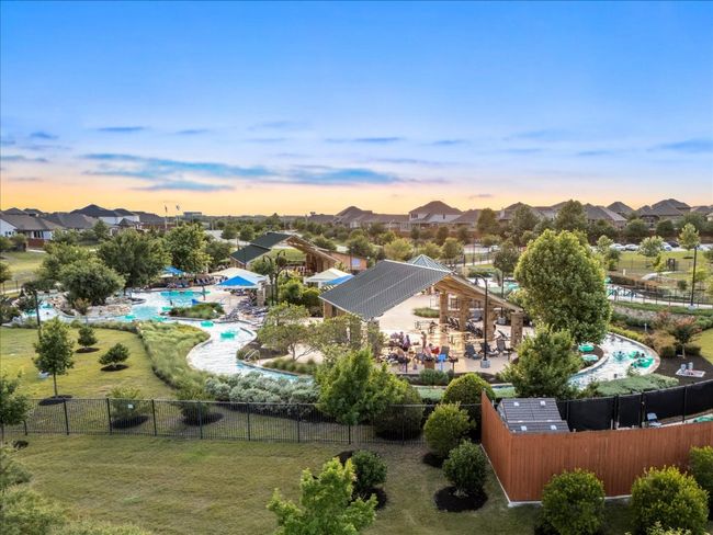 Aerial perspective of lazy river. This community has two lazy river areas, seperate third pool area, parks, and amenities center. | Image 35