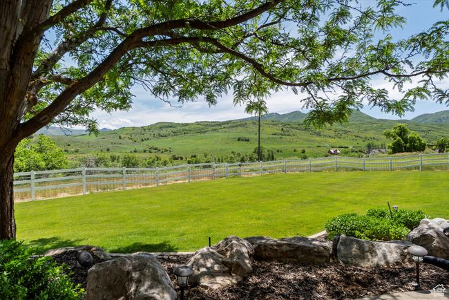 View of yard featuring a view of rural / pastoral area and a mountain view | Image 13