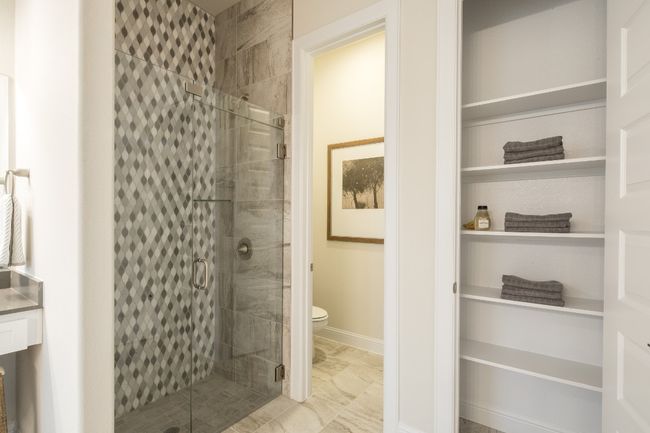 Full bathroom with a stall shower, toilet, and baseboards | Image 19