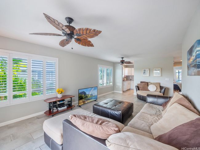 Living room facing kitchen. Plantation shutters throughout | Image 9