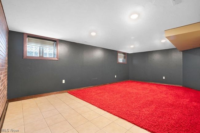Lower level flex space to be used as a rec room, workout space, office or additional bedroom | Image 27